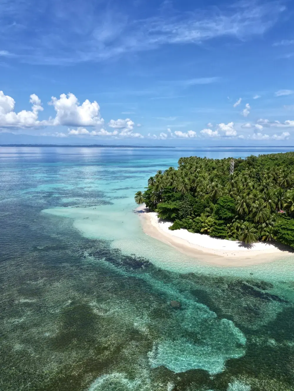 White sand and reef on one of the outer islands, minutes away by boat