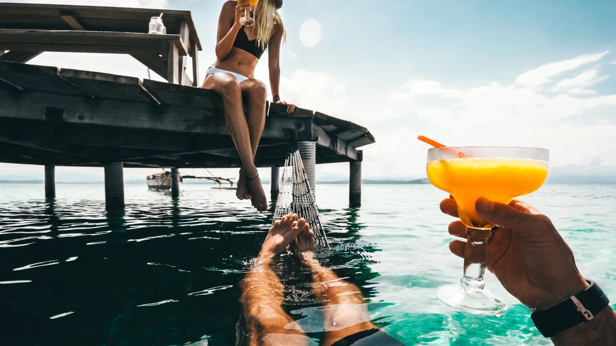 A dock, a hammock in the water and a cold drink in Bocas del Toro